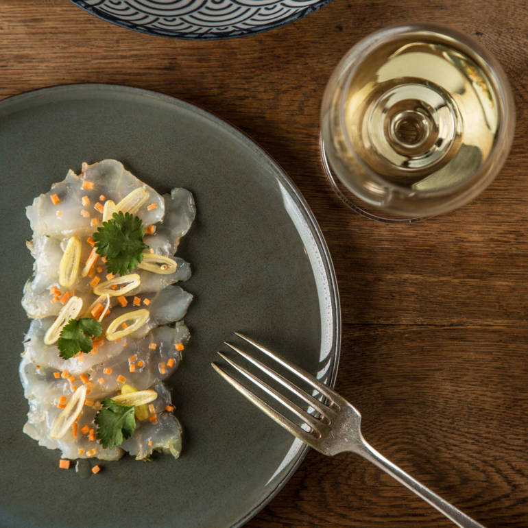 Marinated monkfish carpaccio with coriander, garlic, chives and olive oil